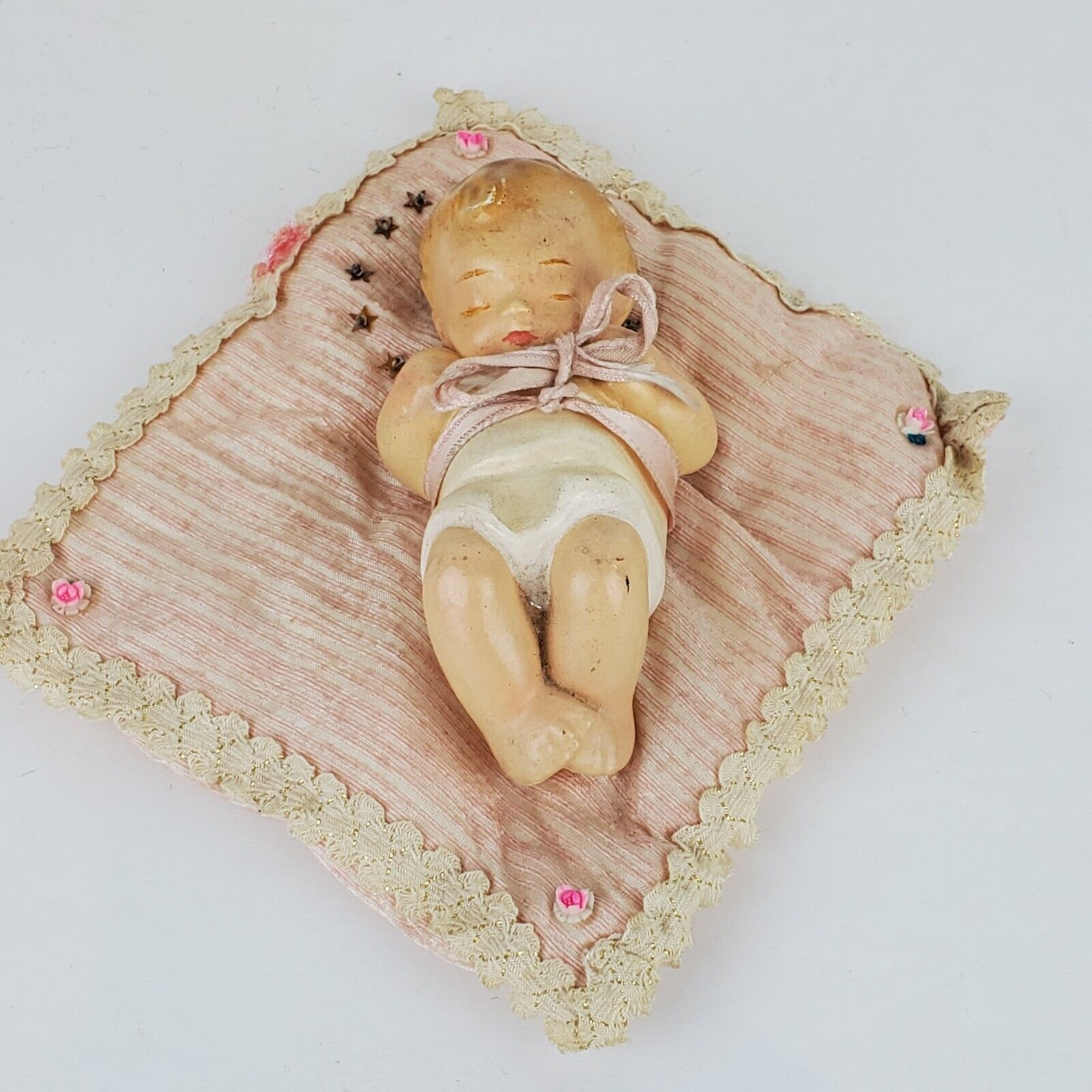 Vintage Baby Jesus Plaster Figurine On Blanket Bow Lace Flowers Has Wear