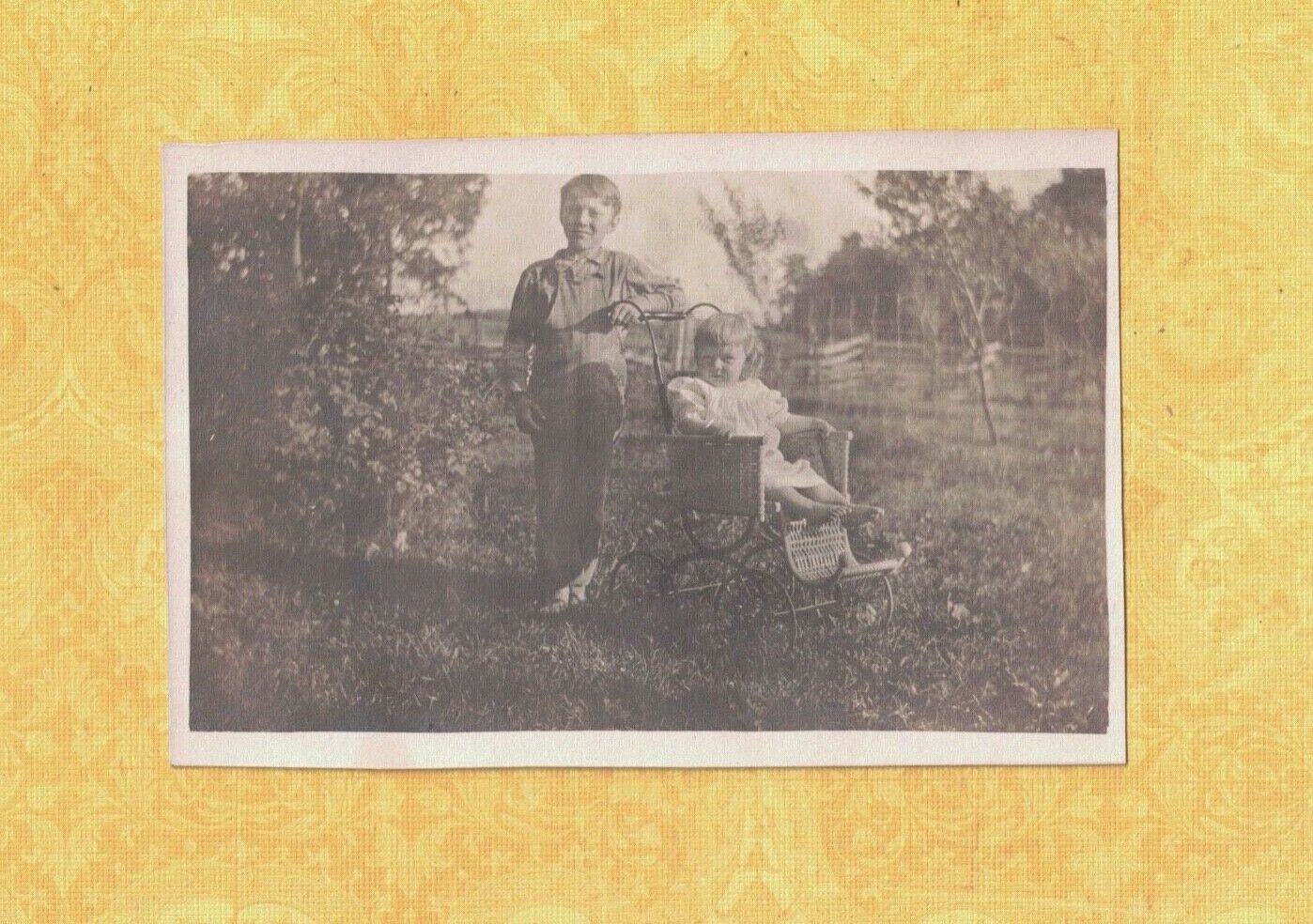 X RPPC BOY & YOUNGER GIRL IN BABY STROLLER 1908-39 antique postcard 