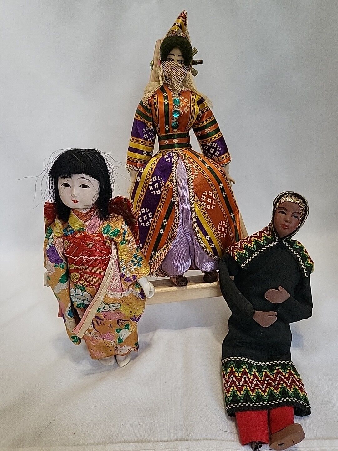 Three Vintage dolls in handmade ethnic dress