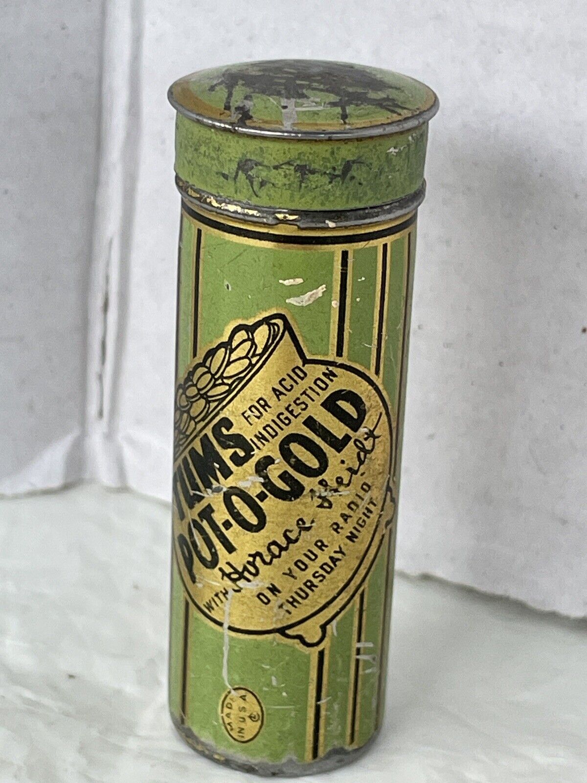 VTG TUMS FOR THE TUMMY POT-O-GOLD with HORACE HEIDT PUSHUP TIN RADIO ADV