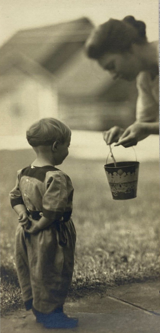 Child With Hands Behind Back Looking At Toy Pail B&W Photograph 2.75 x 6