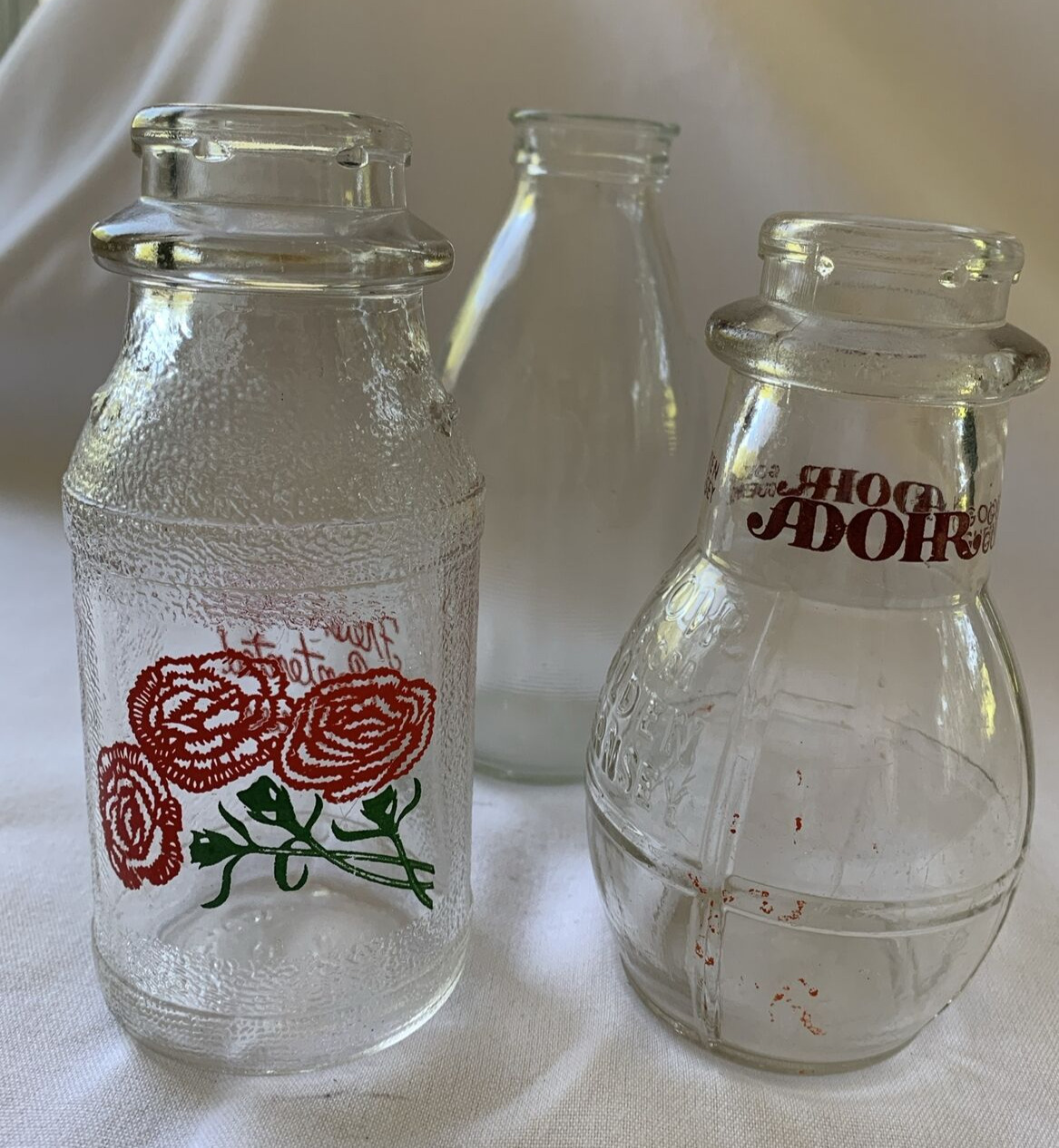 2 Vintage Half Pint Milk Bottles:  CARNATION 3 flowers and ADOHR & Bonus Bottle
