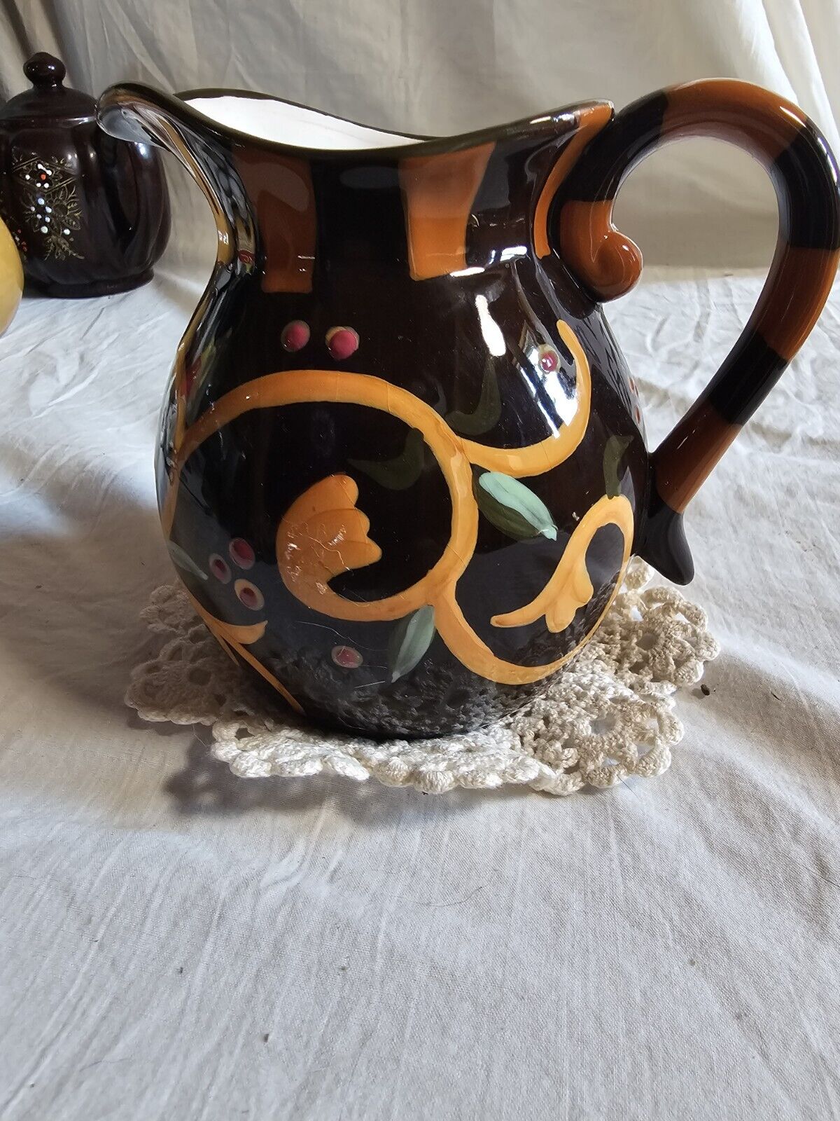 yellow and brown Ceramic Pitcher 