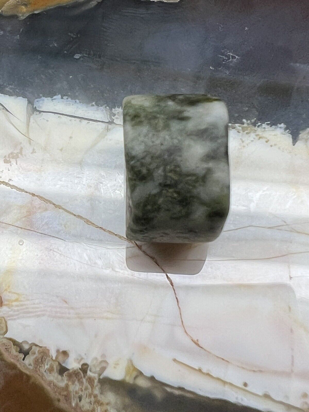 Ancient green jadeite fat disc bead. 12.4 x 8.3 mm pre-Columbian South American