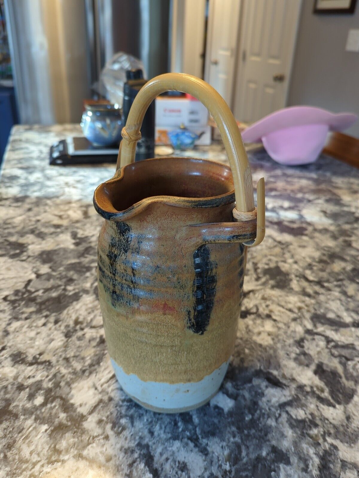 beautiful 8.5  hand thrown signed pottery water pitcher ratan handle