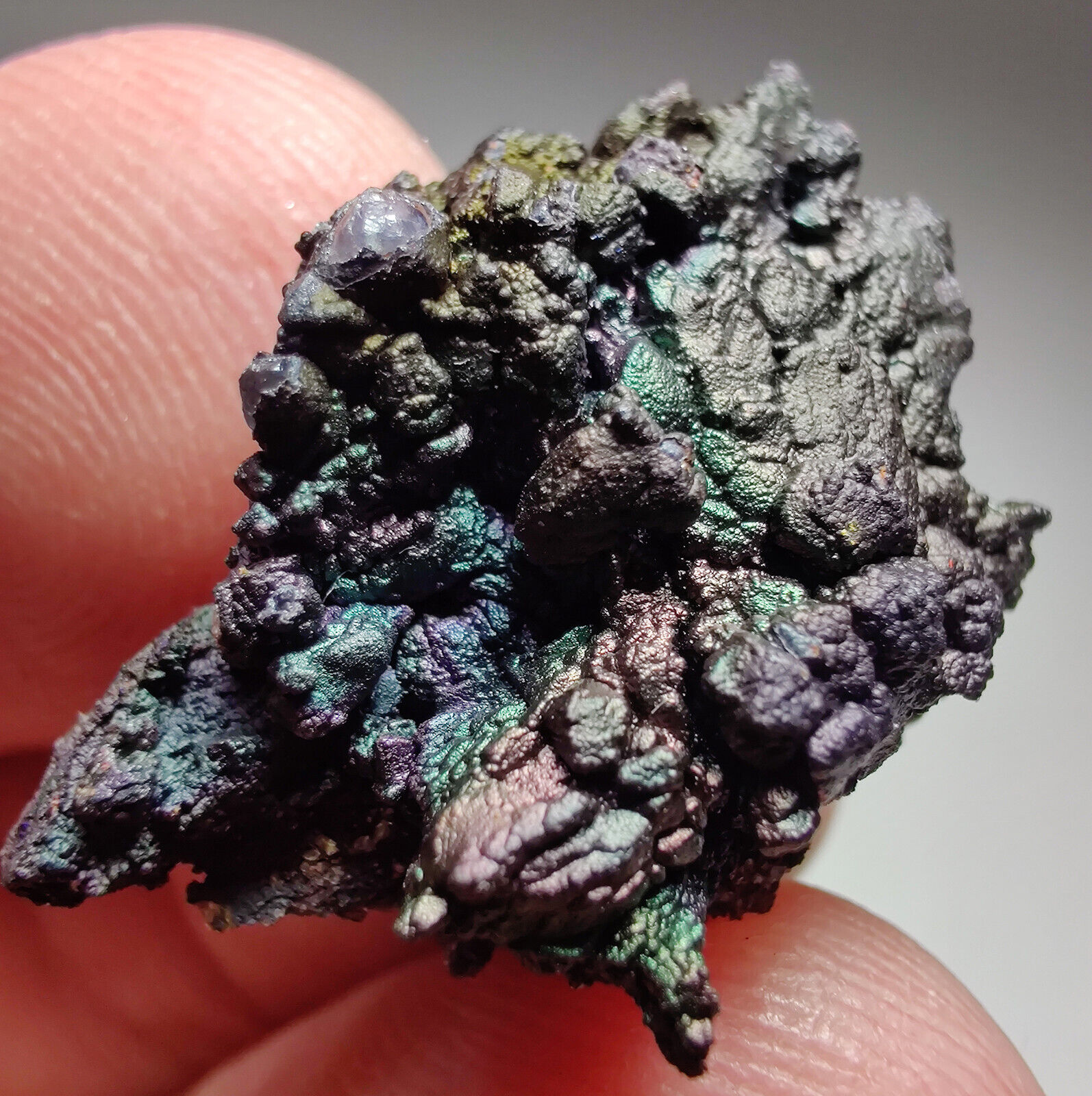 Iridescent Hematite/Turgite on Quartz .  Graves Mtn, Georgia. 4 grams. Video