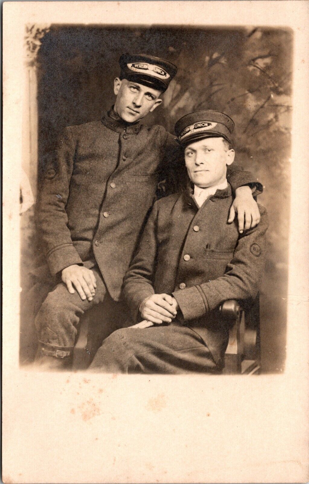 TWO AFFECTIONATE MEN IN WESTERN UNION UNIFORMS (SWEET IMAGE)