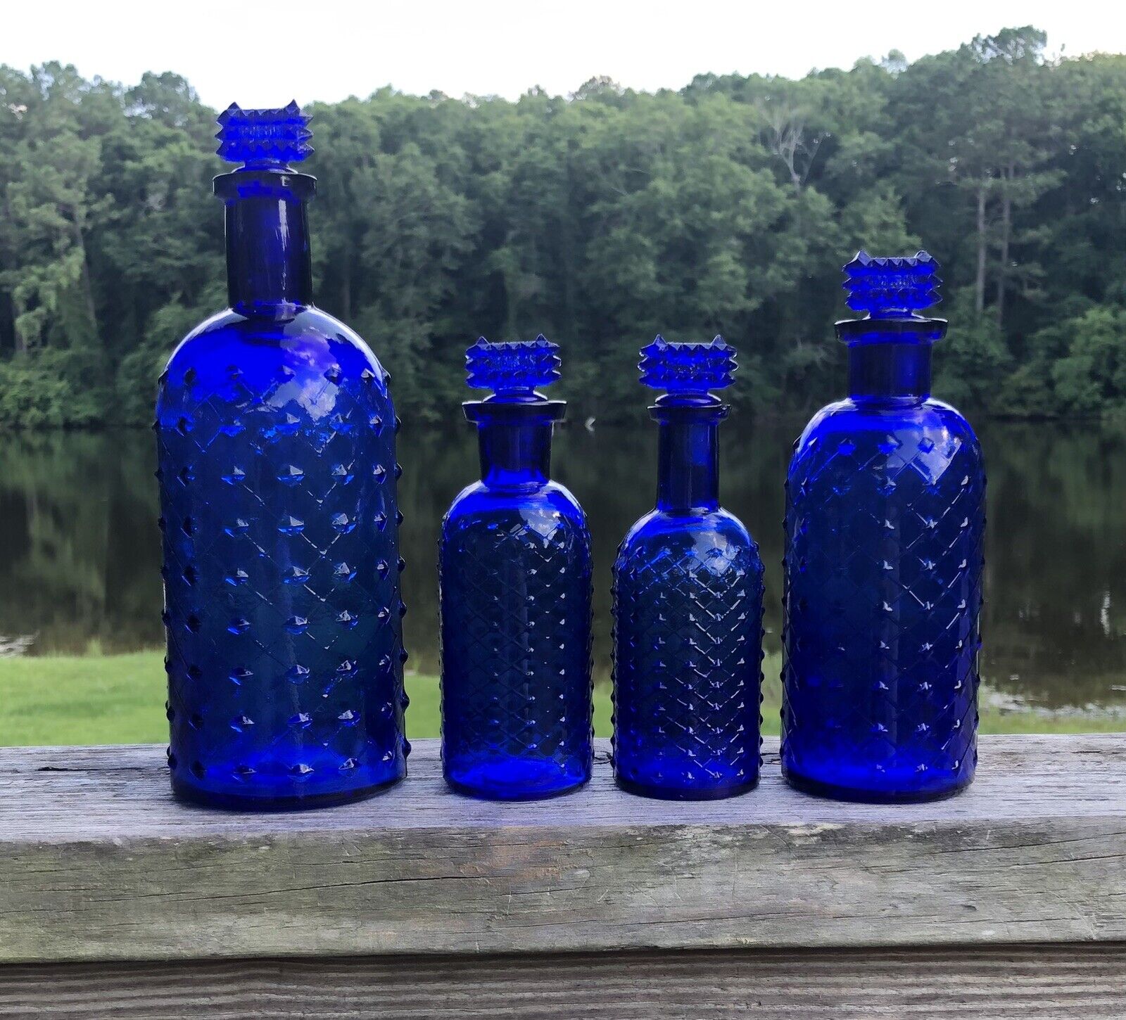 Four Different Size 1890s Cobalt Blue Quilted W T & Co Apothecary Poison Bottles