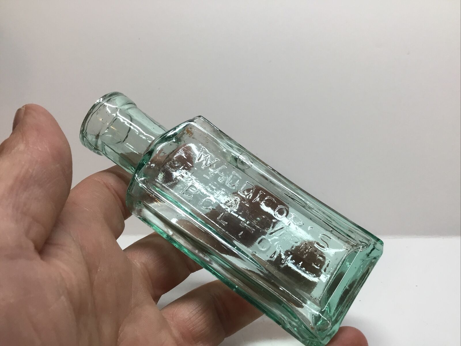 Small Antique Aqua Waddicor’s Celebrated Varnish Bottle.