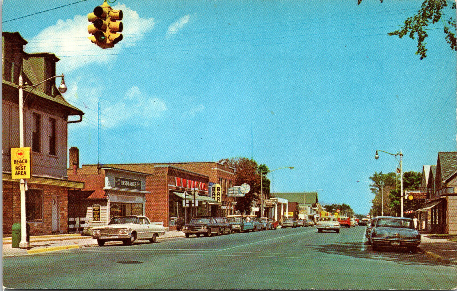 Postcard THIRD STREET, ROGERS CITY, MI, c. 1960\'s,Stores,Bars,60\'s Cars.Unposted