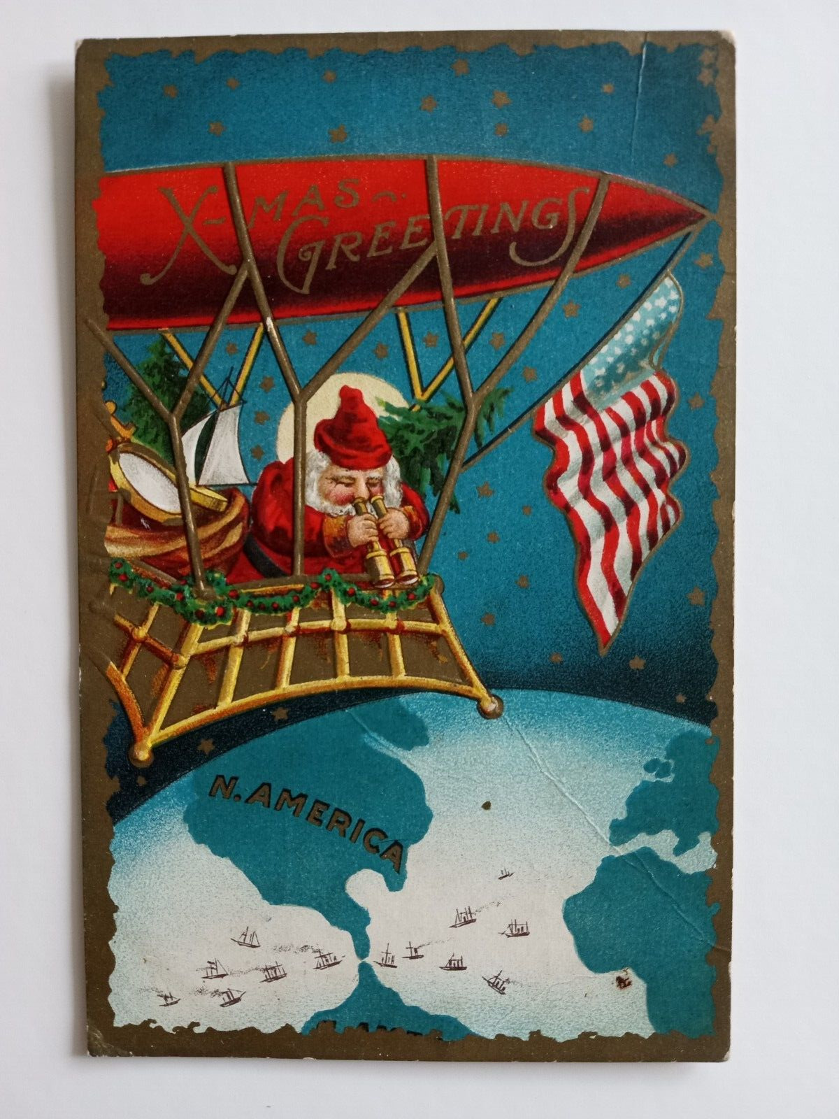 CHRISTMAS GREETINGS POSTCARD 1909 SANTA CLAUS AIRSHIP MAP GLOBE FLAG PATRIOTIC