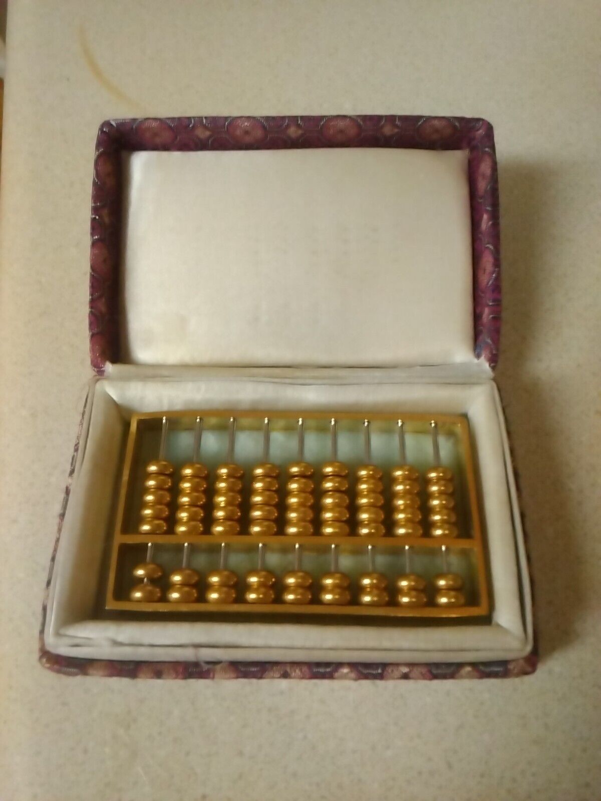 Vintage 1980\'s brass abacus paperweight on marble base with original box