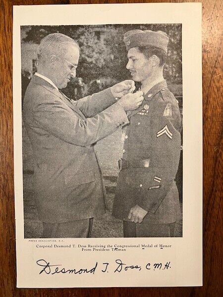EXCEPTIONAL VINTAGE MINT BOOK PHOTO SIGNED BY WW II MEDAL OF HONOR DESMOND DOSS