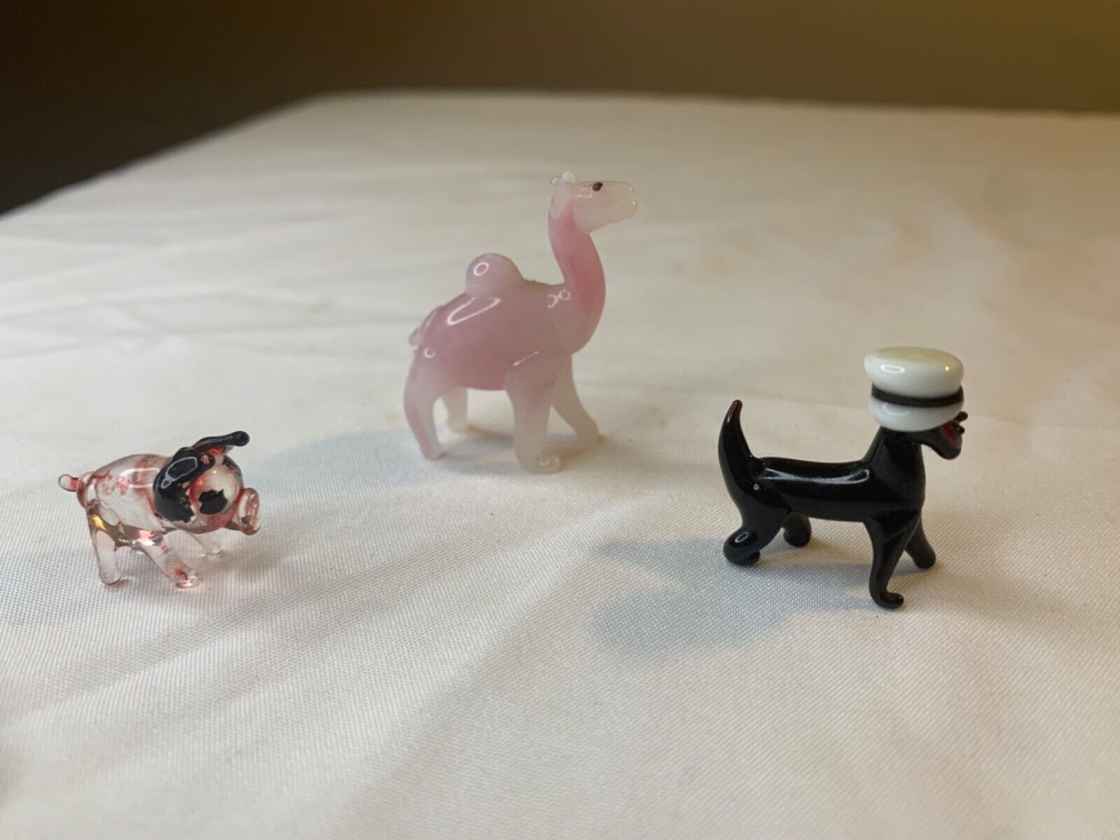 three small glass, figurines, pig camel dog