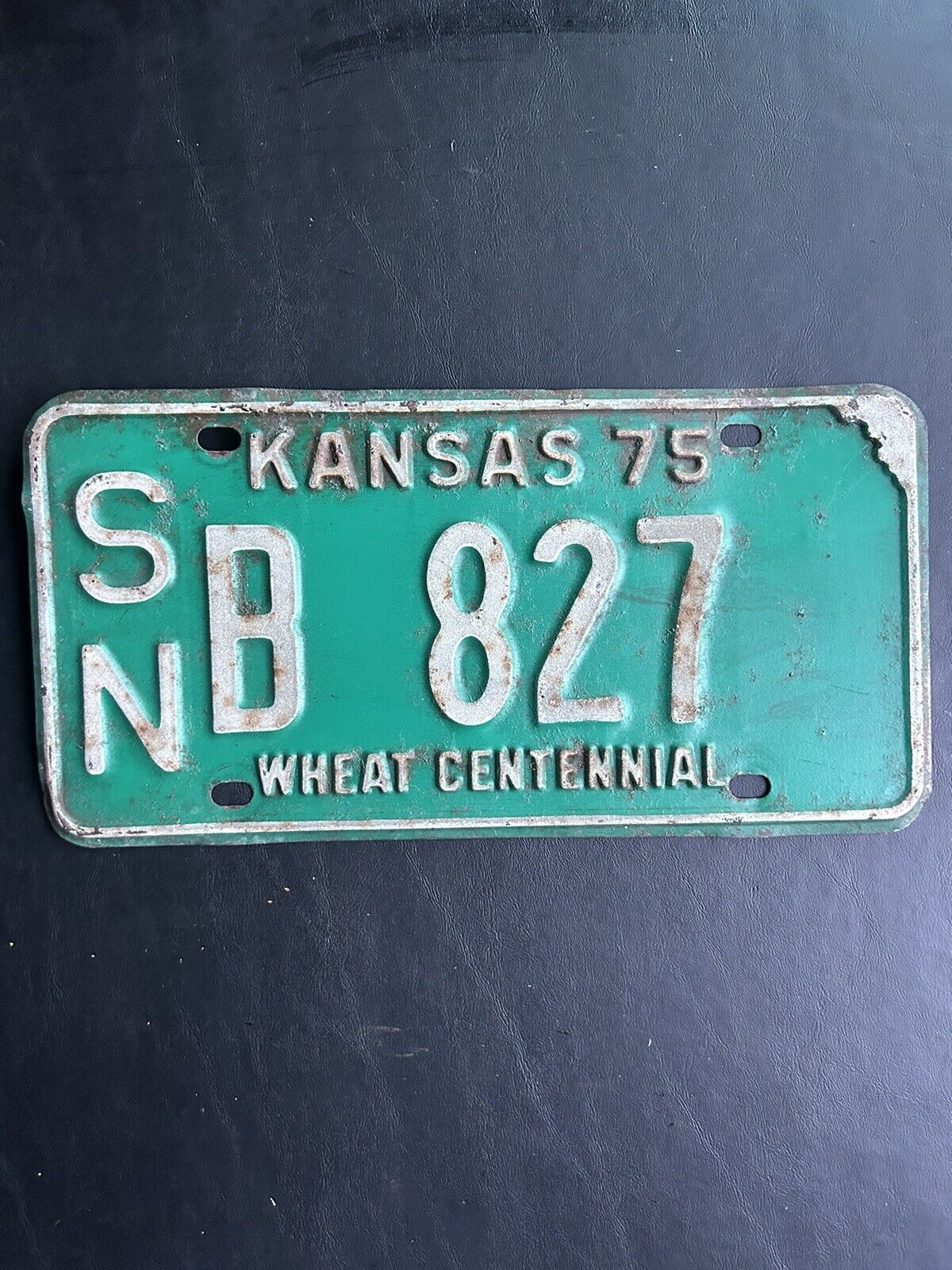 1975 Kansas License Plate s/n B 827 Shawnee County Wheat Centennial Slogan 