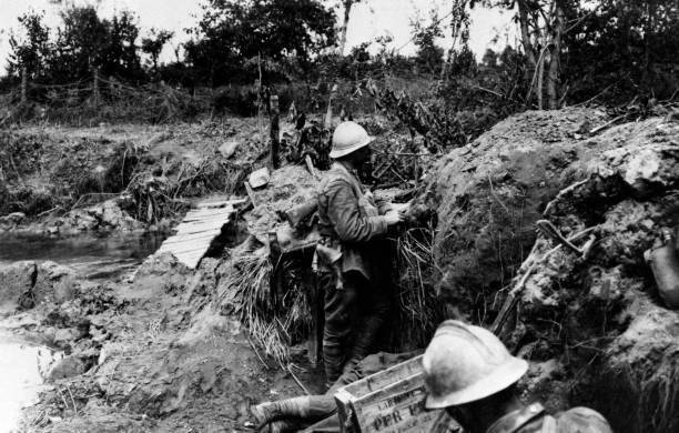 Soldier reading newspaper trench fellow soldier scanning horizon C- Old Photo