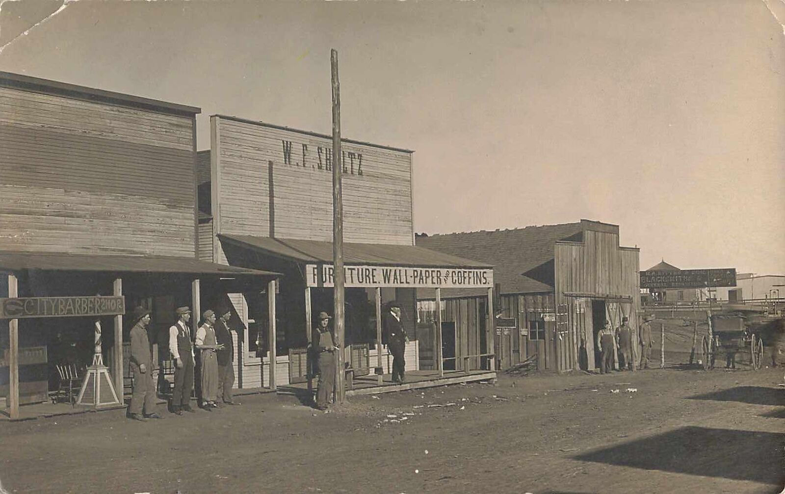 1900s RPPC Rocky Oklahoma Street Scene Coffin Store Blacksmith Photo Postcard