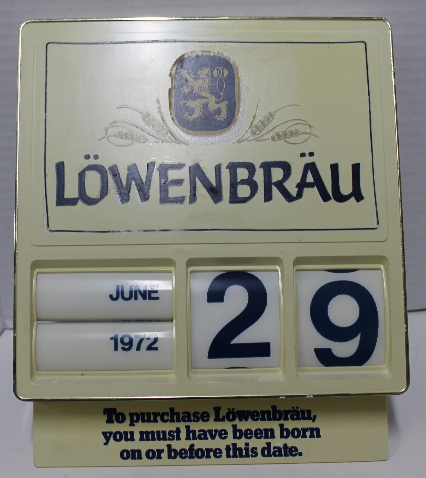 vintage lowenbrau plastic calender - you must be born before this date