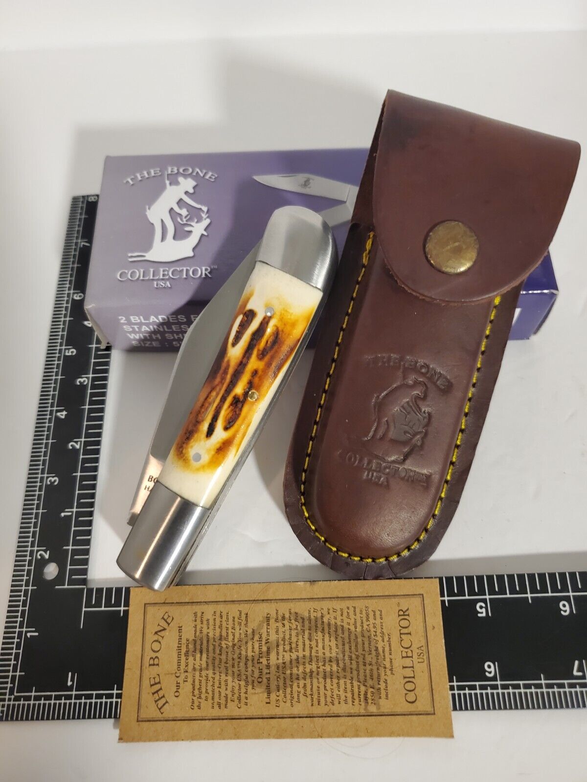 The Bone Collector USA 4 Blade Folding Pocket Knife With Leather Sheath