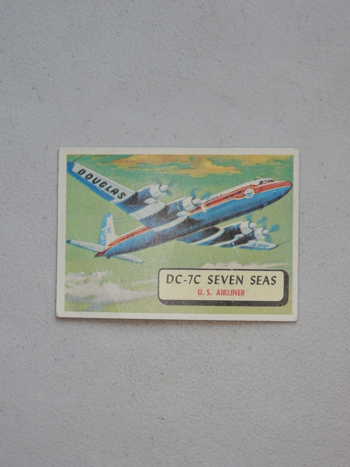 1957 Topps Airplane Trading Card # 69_DC-7C Seven Seas_U.S. Airliner_Red Back