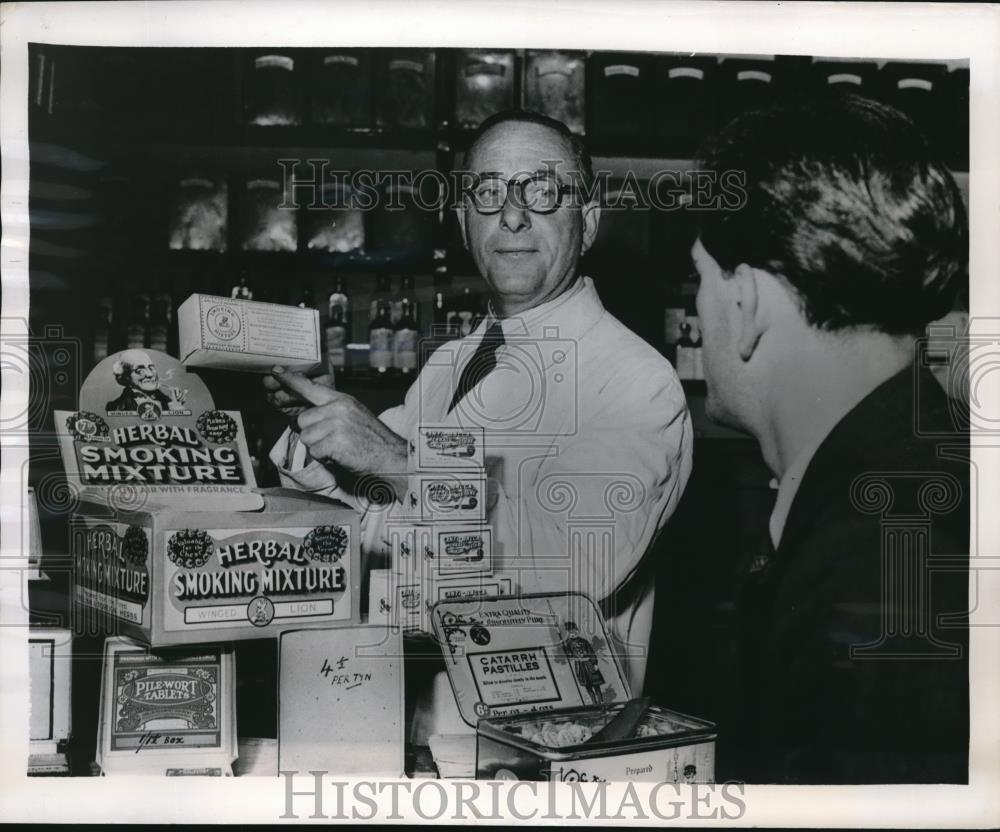 1947 Press Photo Mr Spencer buyinh herbal smoking mix at a shop