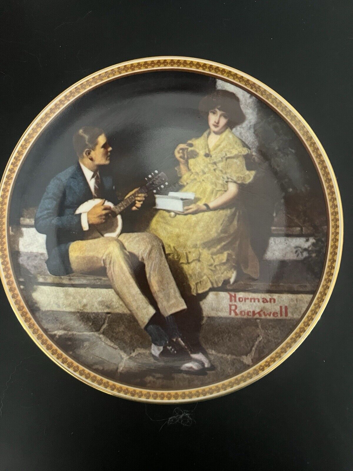 Norman Rockwell Numbered plate “Pondering On The Porch “