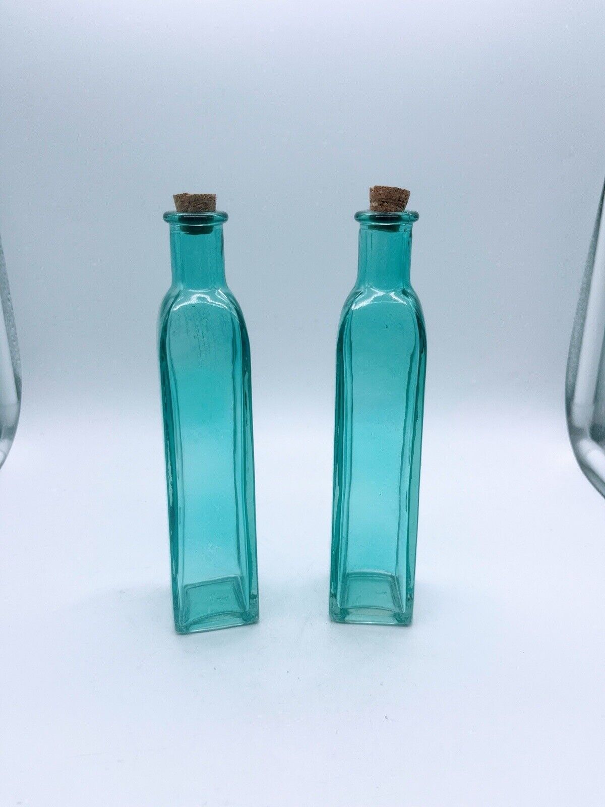 Pair of Aqua Glass Bottles