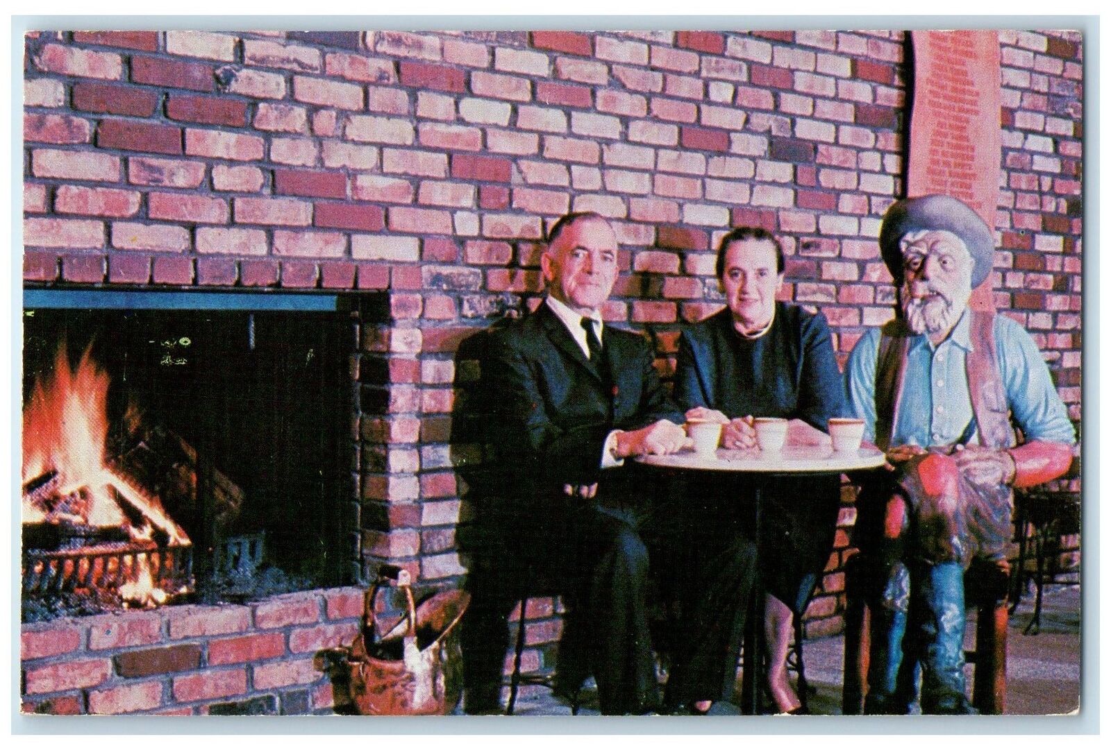 c1960's Ted & Dorothy Hudstead Sitting Wall Drug Store Black Hills SD Postcard