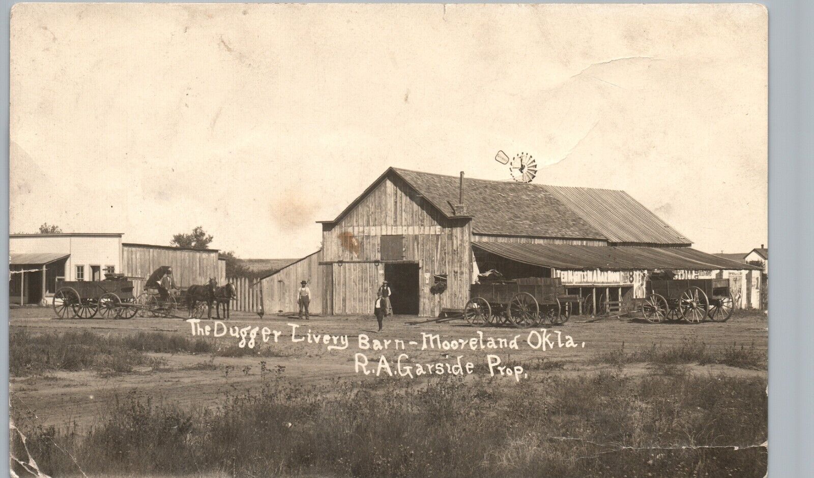 LIVERY STABLE antique real photo postcard rppc MOORELAND OKLAHOMA OK c1910 barn