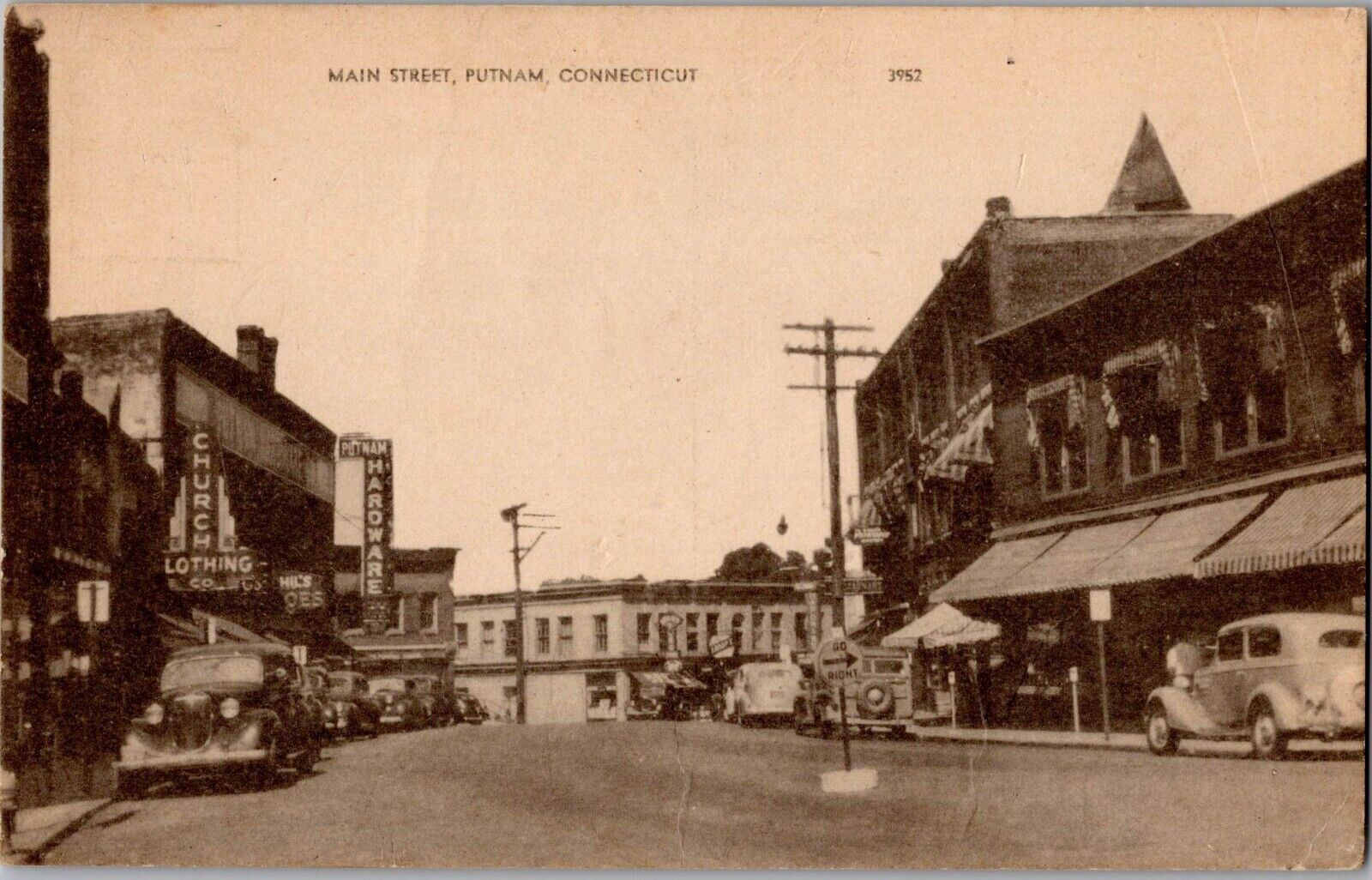 c 1940 Putnam, Connecticut Main Street Postcard Hardware Store Putnam Clothing