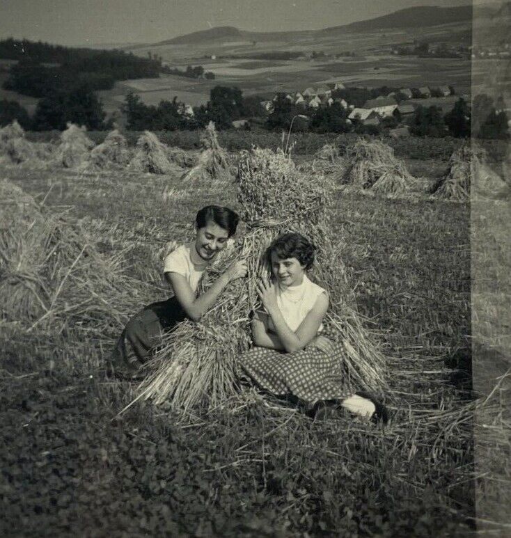 Two Smiling Girls Sitting By Hay Stack B&W Photograph 2.5 x 2.5