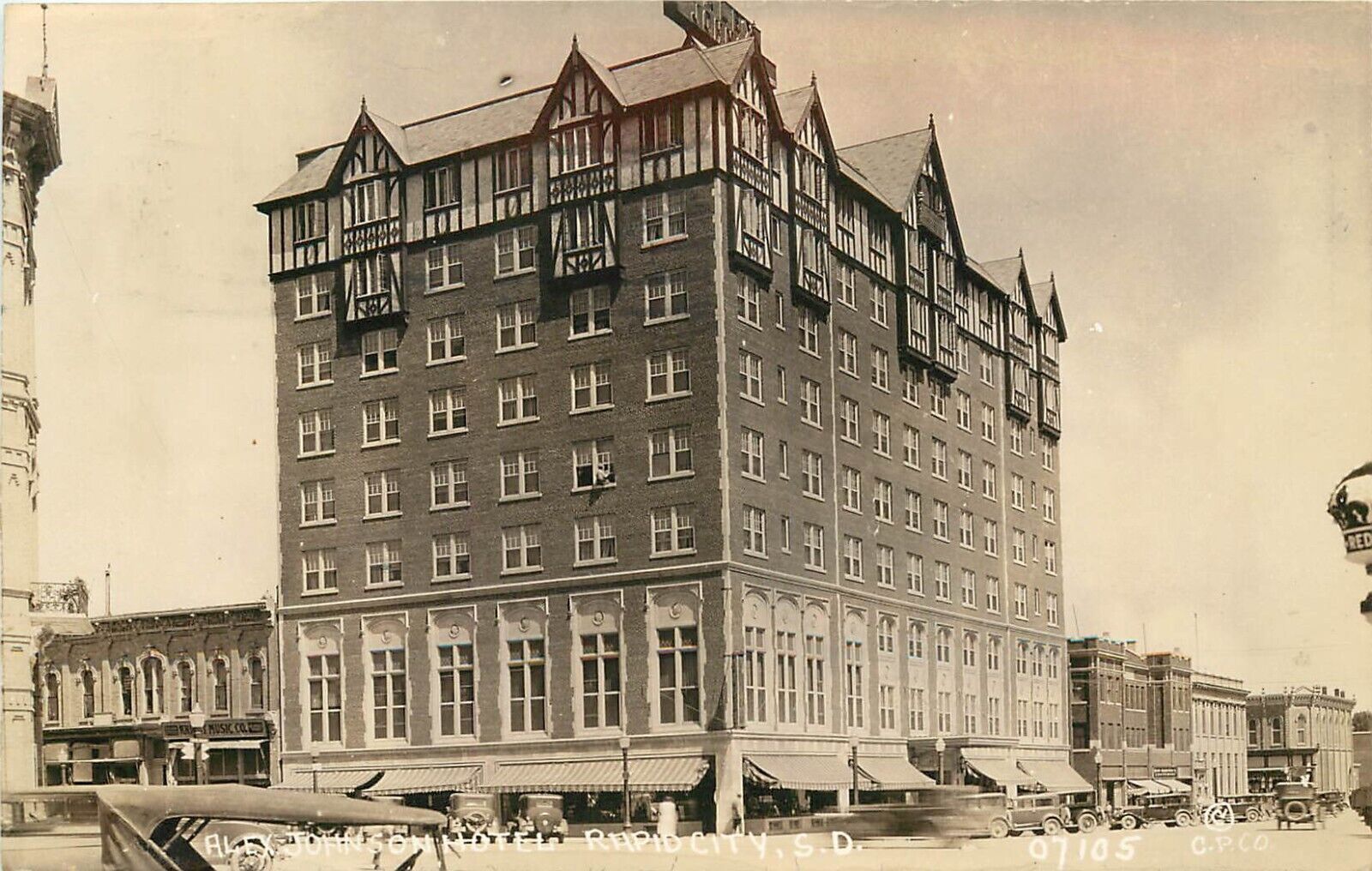 RPPC Rapid City SD Alex Johnson Hotel Street Scene, 07105 C.P. Co., Posted 1931