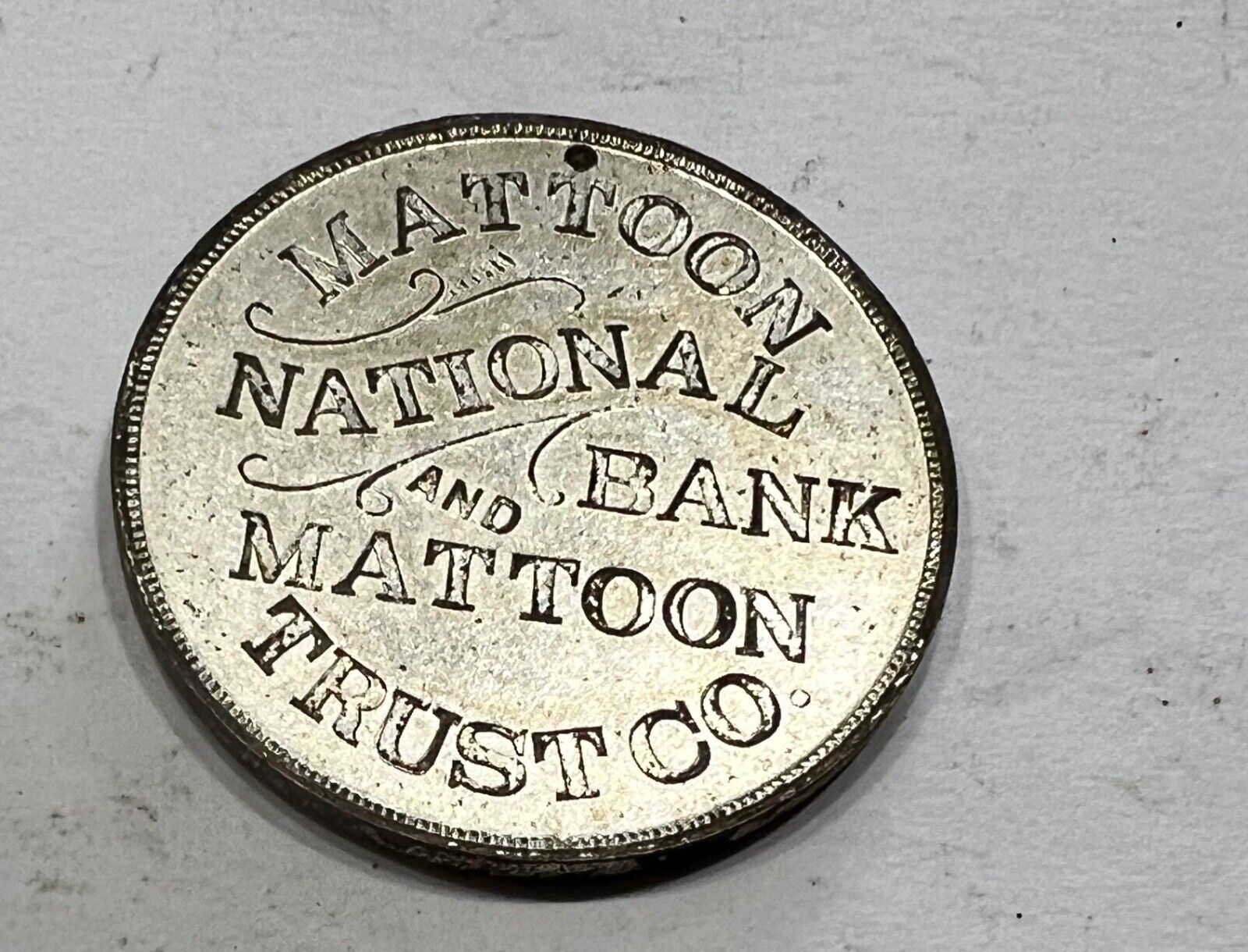 MATTOON IL National BANK & TRUST CO adv TOKEN COIN age?