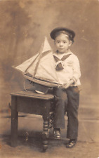 RPPC Young Sailor Boy Holding Pond Sailboat Jos. Fischl NYC Photo Postcard picture