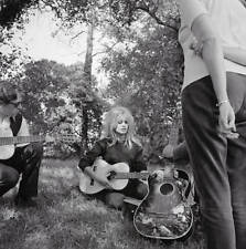 Brigitte Bardot plays a guitar as she relxaes between shooting- 1961 Old Photo picture