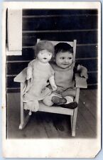 Postcard RPPC Happy Young Girl In Rocking Chair With A Doll P8O picture