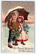 1910 Christmas Boy Girl Doll Umbrella Snowfall Winter Holly Embossed Postcard picture