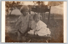 RPPC Postcard~ Children Pictured Outdoors~ Siblings~ One Child Sitting In Chair picture