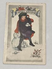 1921 Merry Christmas Postcard Cute Girl Holding Snowballs Next To Snowman picture