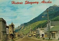 Vintage Historic Skagway Alaska classic cars dirt street signs scenic. A2-329 picture