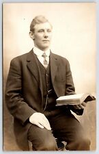 RPPC Young Preacher or Student Sits on Stool Holds Bible or Other Book~c1910 picture