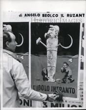 1956 Press Photo Anti-Red Election Poster in Italy Taken Down bu Communist Chief picture