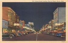 Elyria Ohio~Broad Street West~Neon Night Lights~Cars~1941 Postcard picture