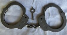 VINTAGE POLICE S&W HANDCUFFS MODEL 90 AND KEY SHOWING AGE COMPLETELY FUNCTIONAL picture