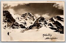 Eiger Monch Jungfrau Switzerland RPPC Man Skiier? Snow 1934 New Year Postcard picture