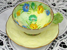 RARE PARAGON  FLORAL PALE YELLOW EMBOSSED FLOWER HANDLE TEA CUP AND SAUCER picture