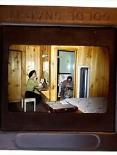 1950s 35mm Slide Man Sitting on Toilet Woman Applying Makeup Motel Room Interior picture