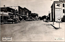 NEW ROCKFORD, NORTH DAKOTA - BUSY STREET VIEW - MOBILGAS - REAL PHOTO POSTCARD picture