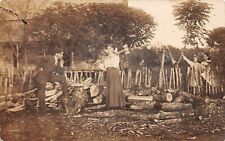 RPPC Women Chopping Wood Husband and Children Pensively Watching Humorous 9439 picture