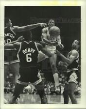 1988 Press Photo Rockets' Rodney McCray passes ball through Spurs' defenders. picture